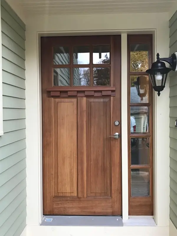 Remodeled front entryway with unique wood and glass front door