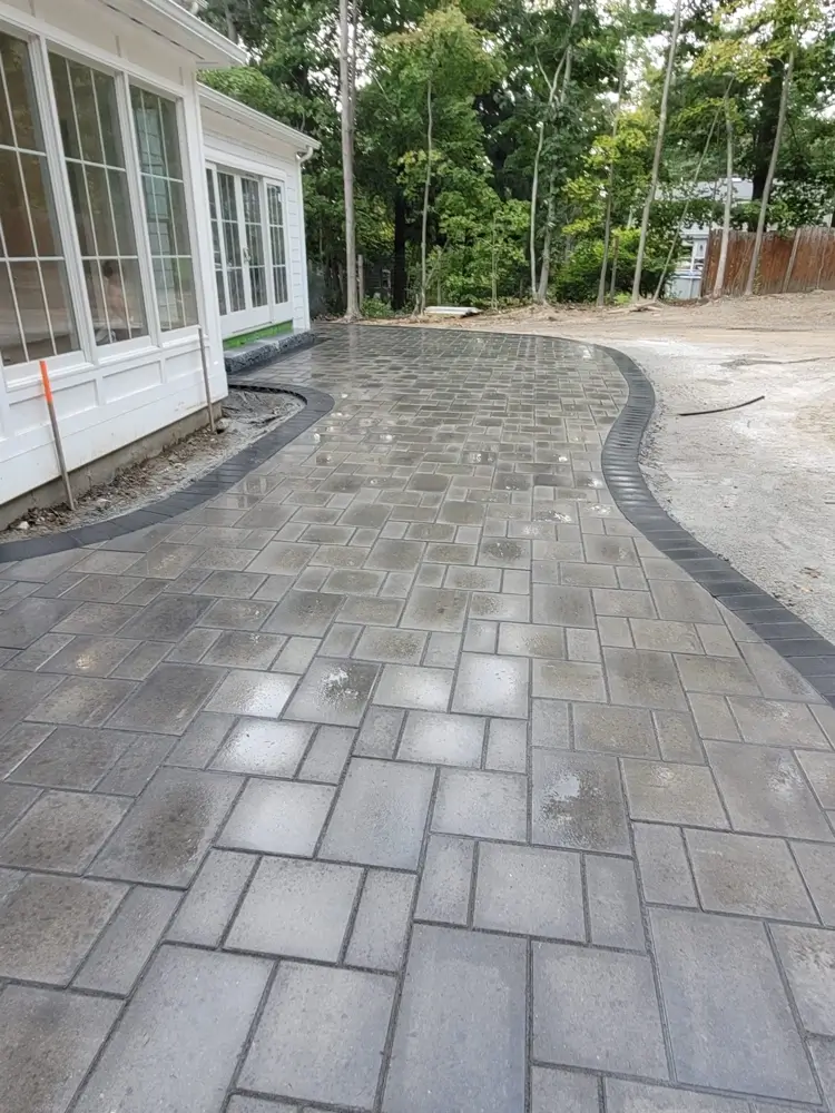 New stone patio behind home