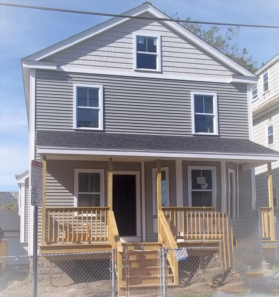 New construction home three stories with front porch