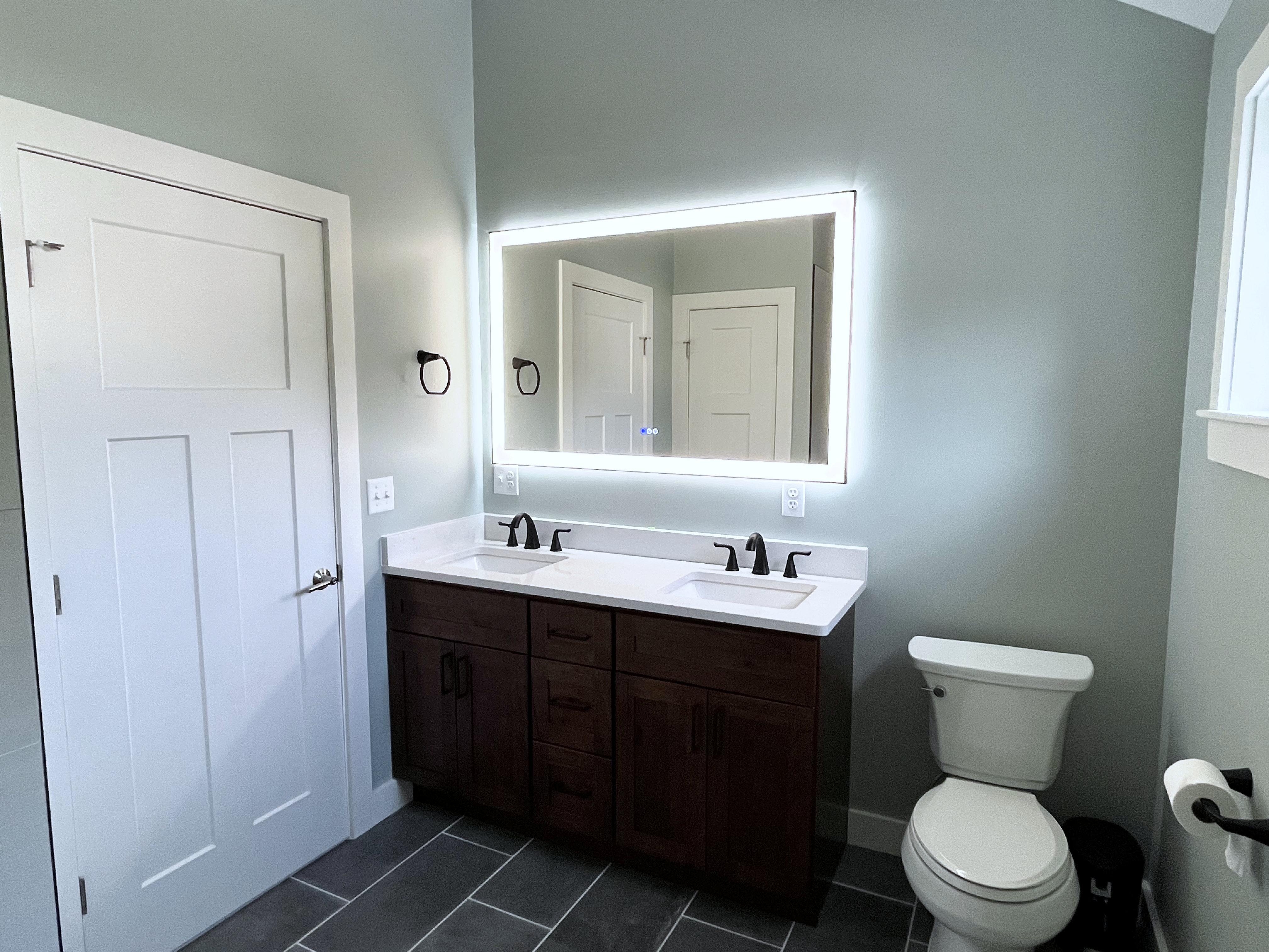 Brand new master bathroom renovation with new granite countertop vanity