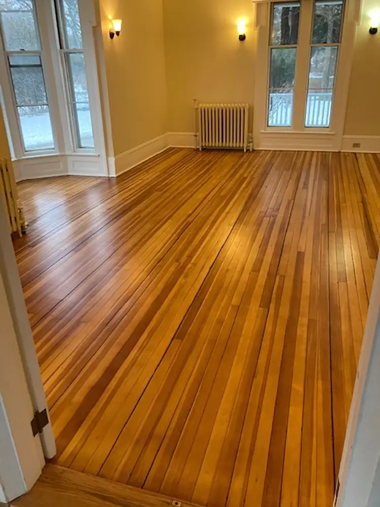 Refinished hardwood floors in parlor room