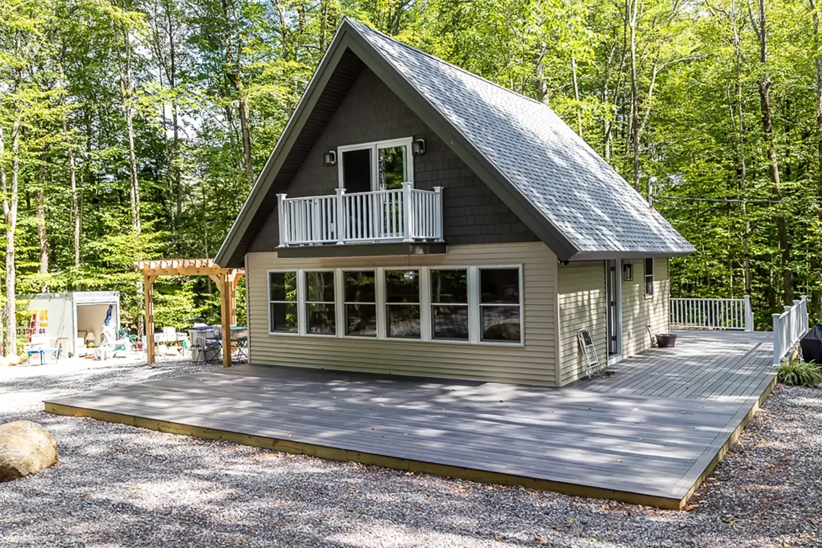 Full gut renovation project of cabin with deck exterior shot