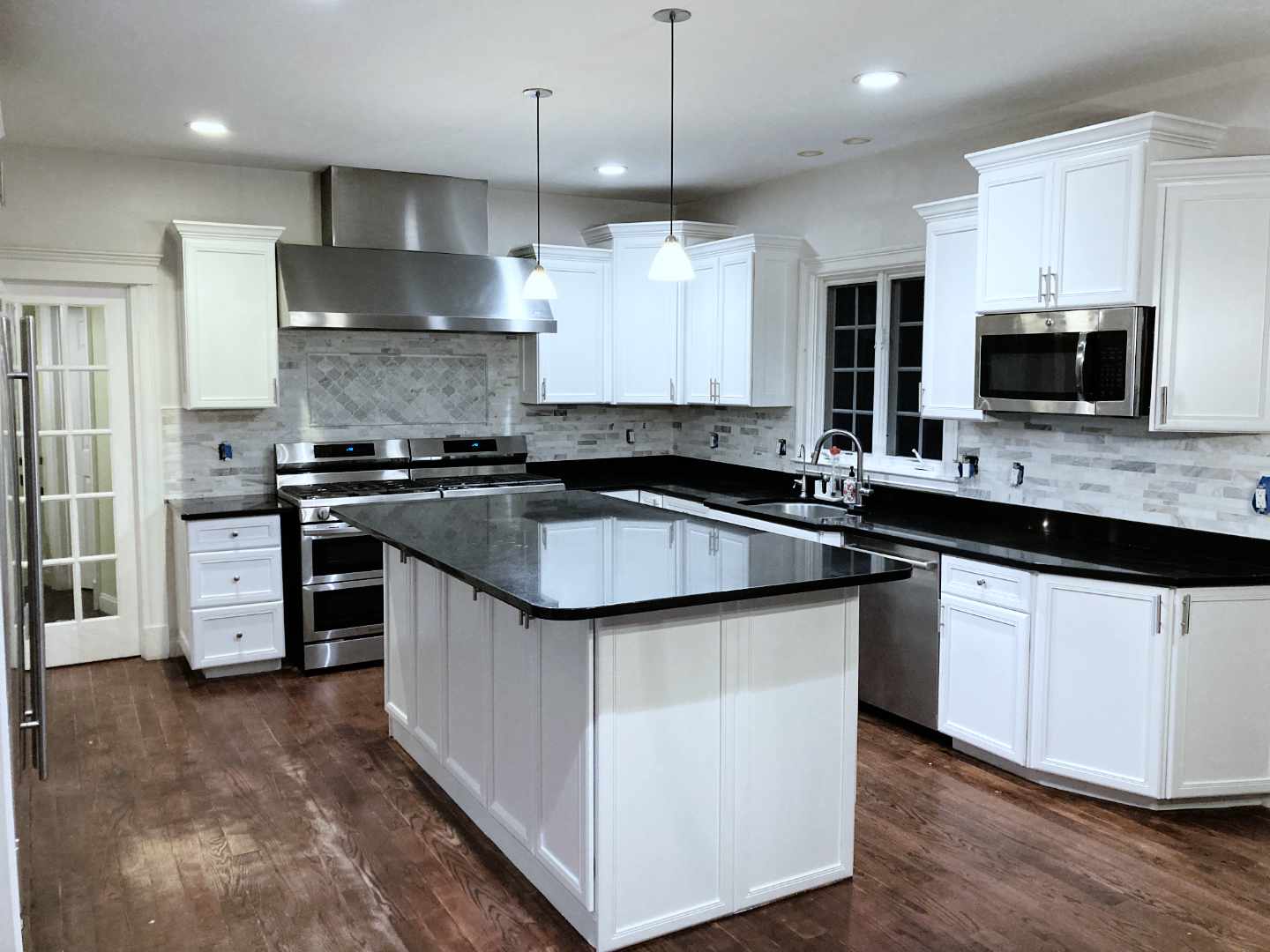 White kitchen cabinets recently refinished